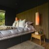 Modern Bedroom with Custom Wood Paneling and Ambient Lighting